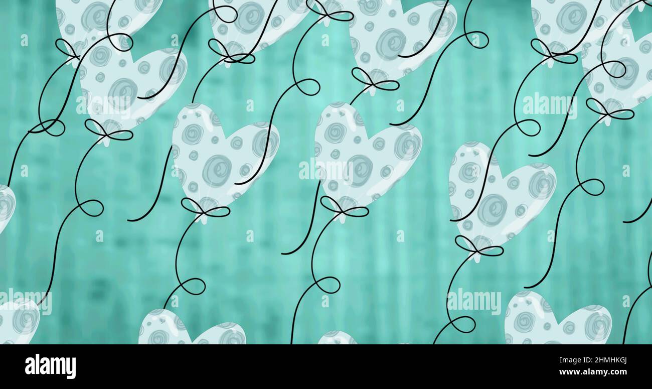 Image de ballons à cœur bleu survolant un arrière-plan bleu Banque D'Images