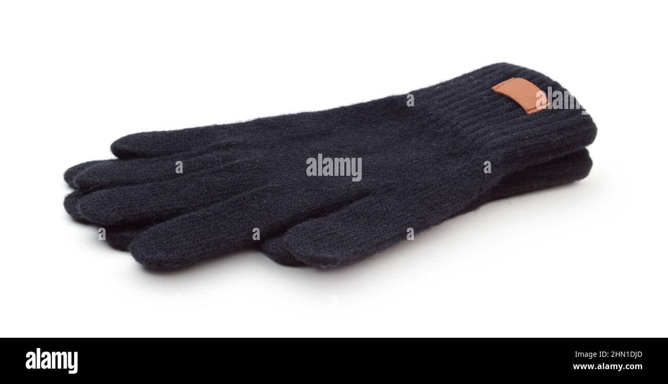 Une paire de gants en laine chaude d'hiver noirs isolés sur du blanc. Vue latérale. Banque D'Images