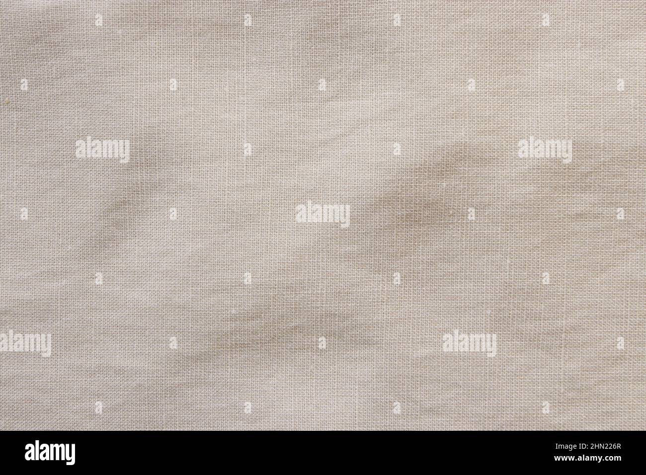 Nuance de texture en tissu mélangé de lin ivoire. Textile d'été. Banque D'Images