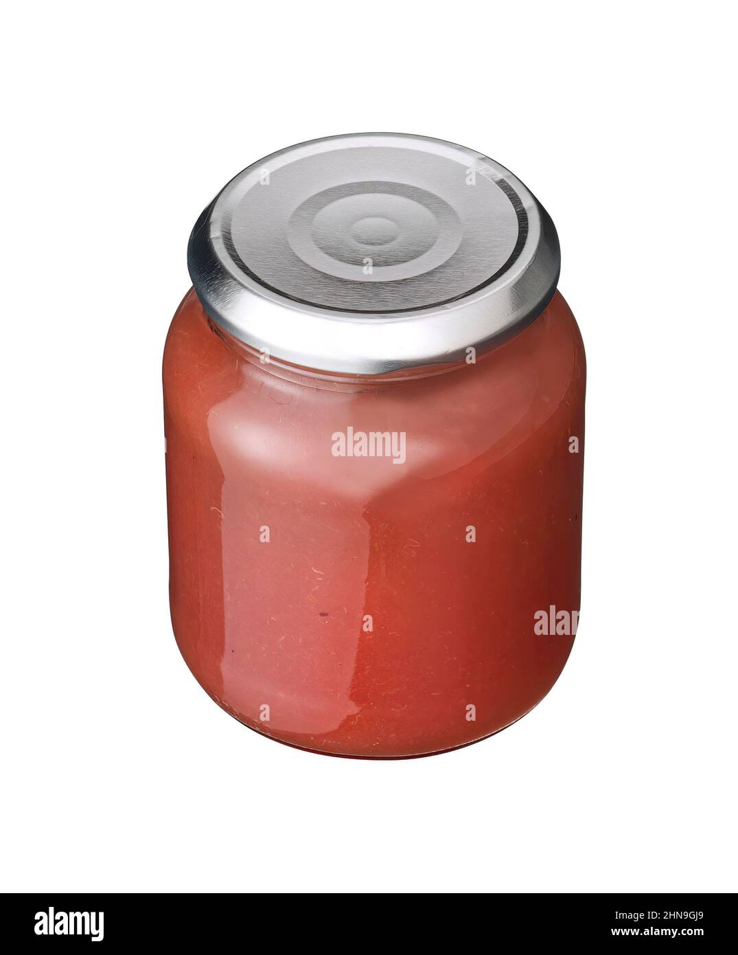 compote de grenade dans un pot isolé sur blanc Banque D'Images