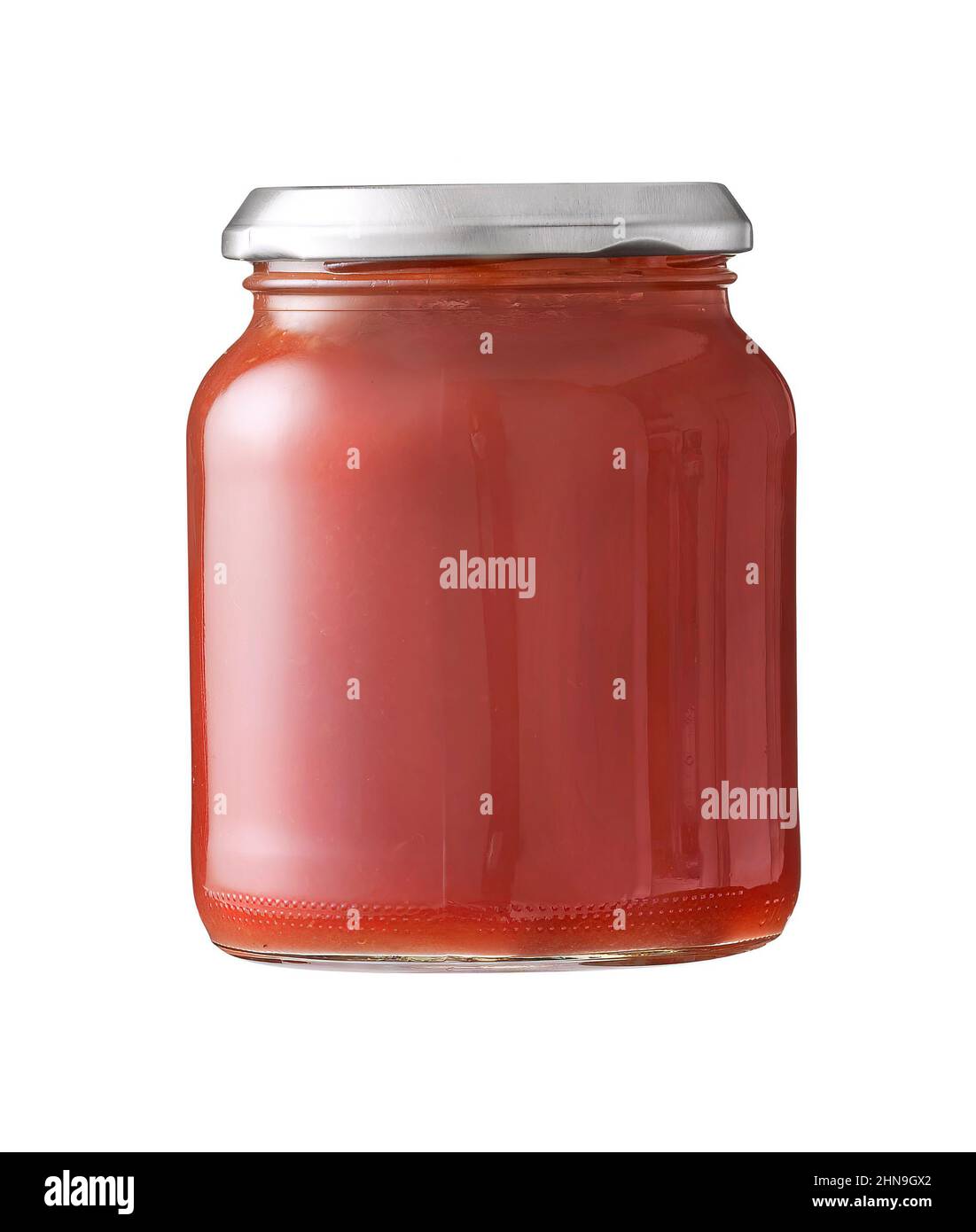 compote de grenade dans un pot isolé sur blanc Banque D'Images