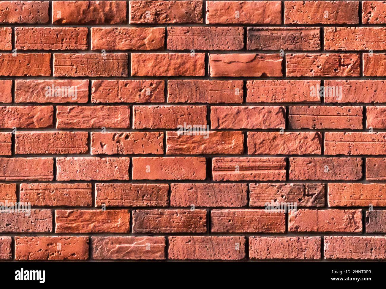 sans couture motif vintage rouge brique mur fond de couleur rouge . Vieux blocs de pierre rouge texture briques rouges naturelles mur . Matériau de projection Photoshop Banque D'Images
