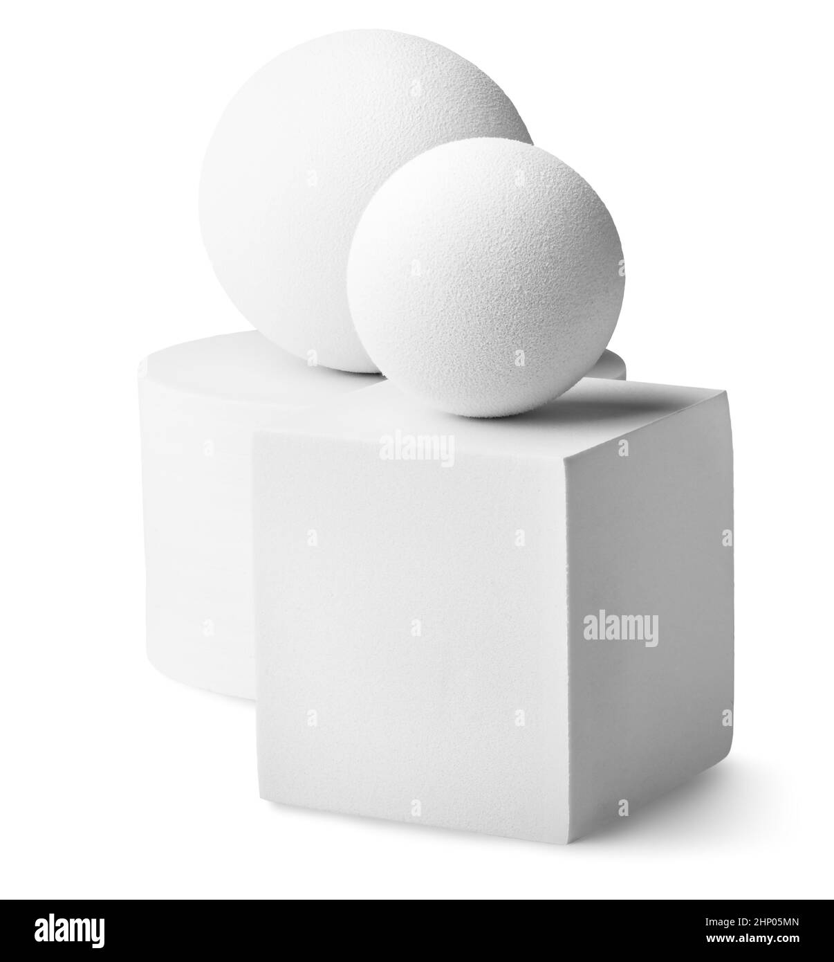 Cylindre blanc, deux boules et un carré isolé sur fond blanc Banque D'Images