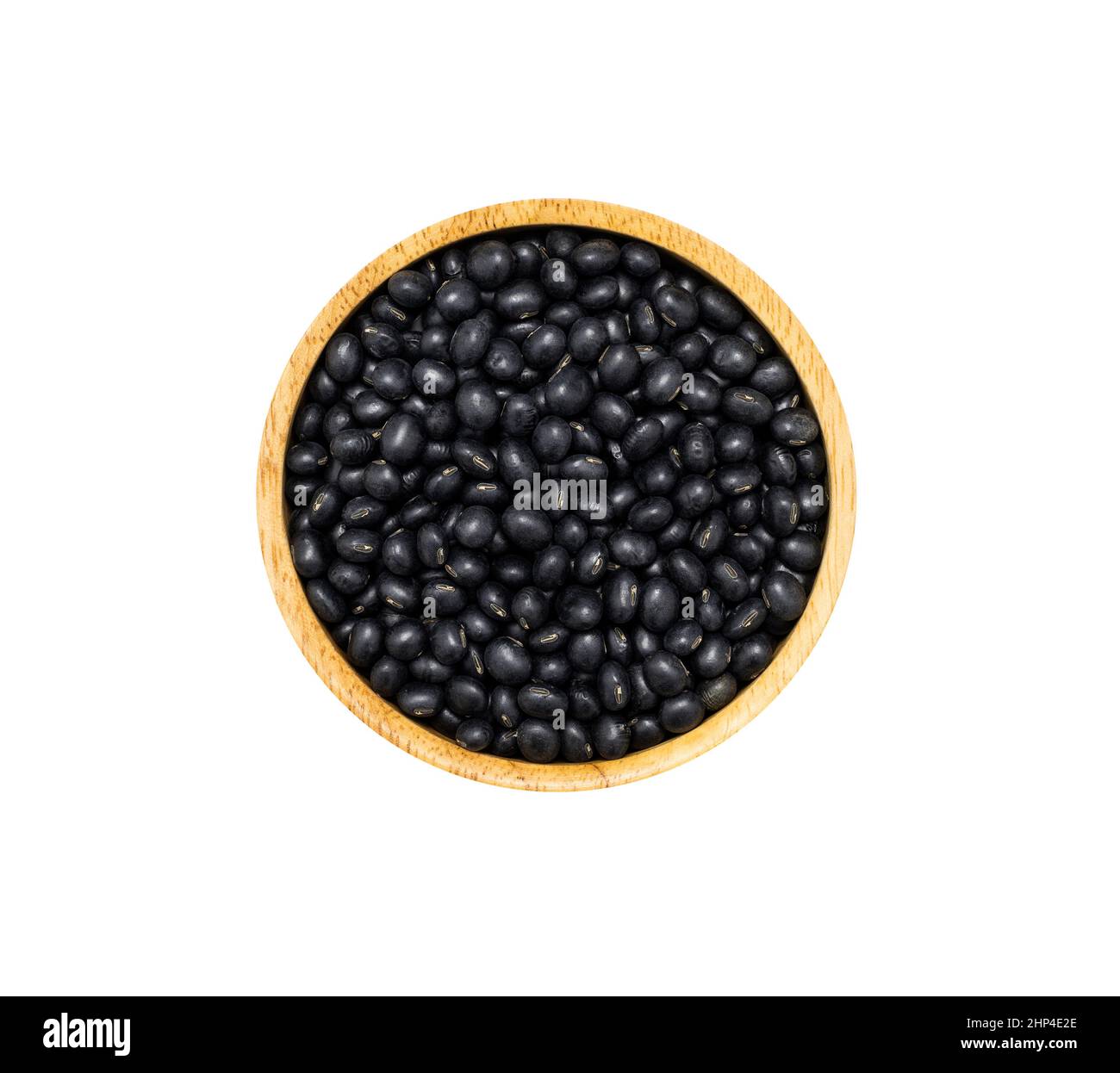 Soja noir dans un bol en bois marron isolé sur fond blanc, vue de dessus. Concept de super alimentation biologique saine Banque D'Images
