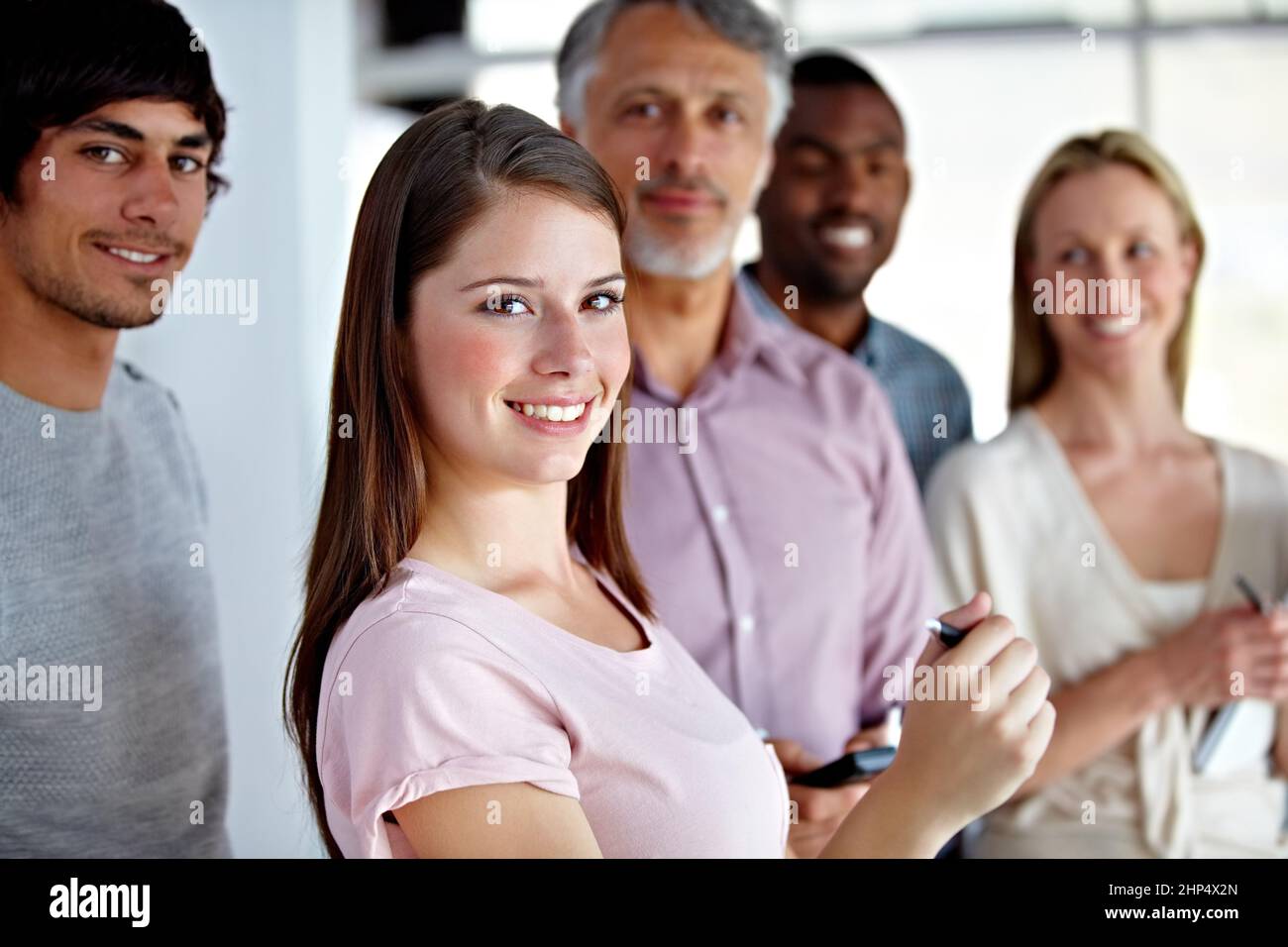Je l'ai sous contrôle. Portrait d'un groupe heureux d'associés d'affaires. Banque D'Images