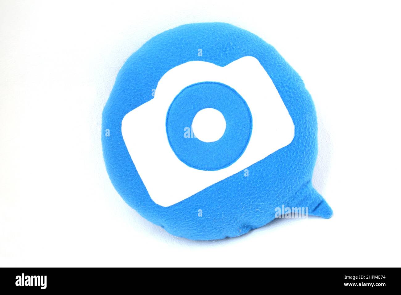 Oreiller Throwboy design en forme de bulle vocale avec logo de l'appareil photo Banque D'Images