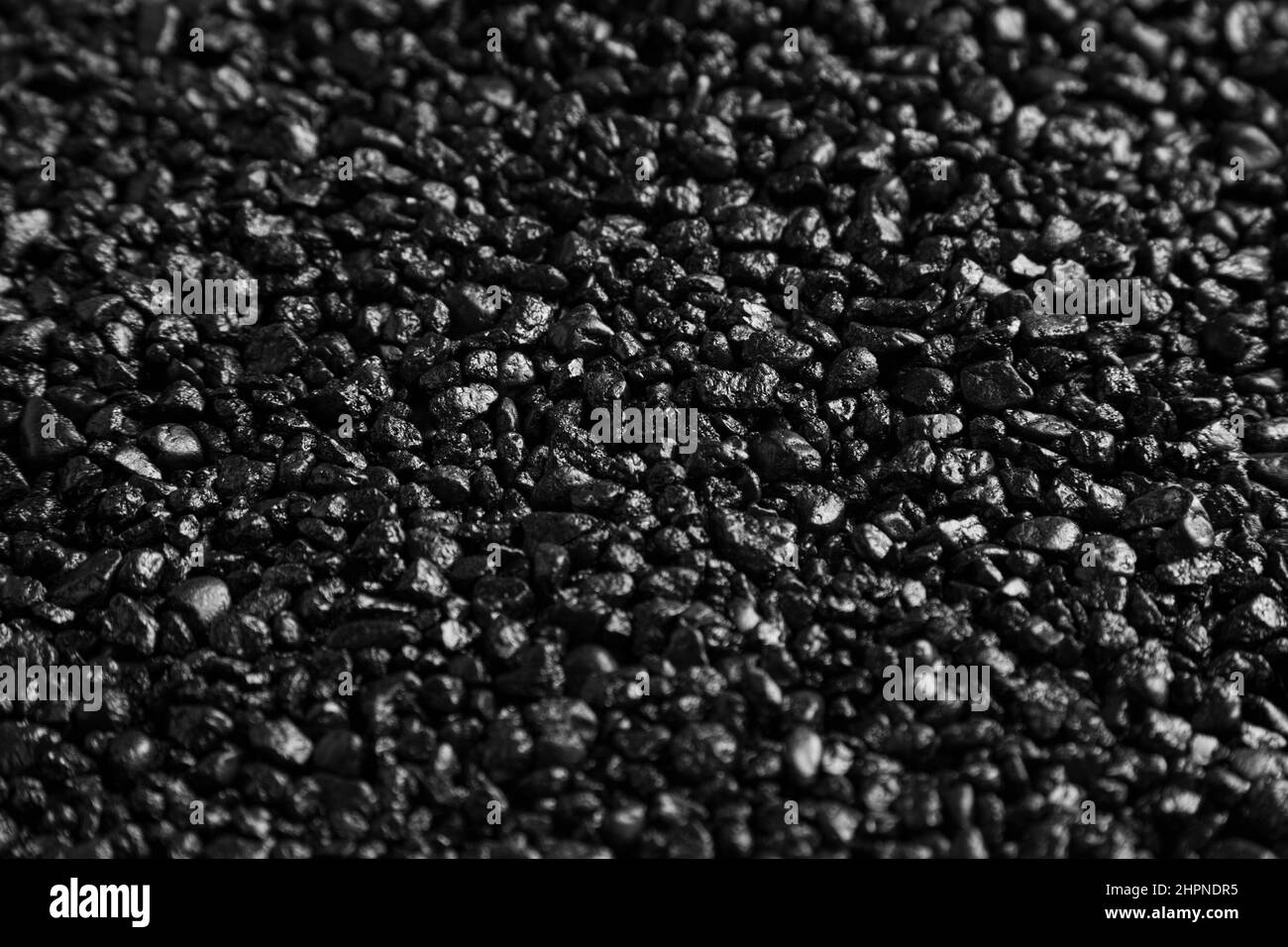 Une image de la vraie petite texture de galets de roche noire. Banque D'Images