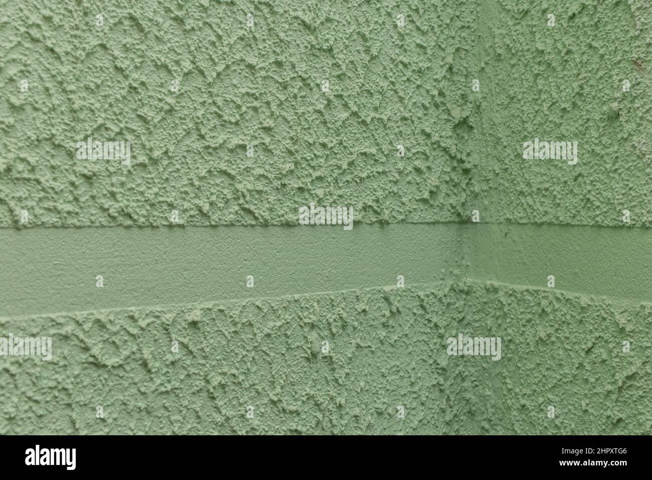Angle de joint plâtre mur vert stuc architecture intérieur structure. Banque D'Images