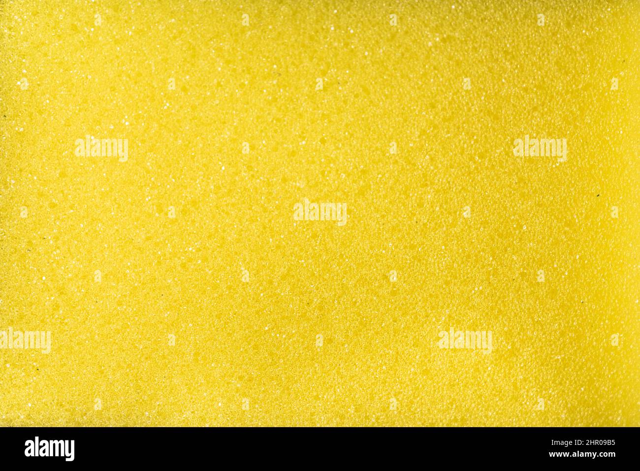 Gros plan sur fond de texture éponge jaune. Banque D'Images