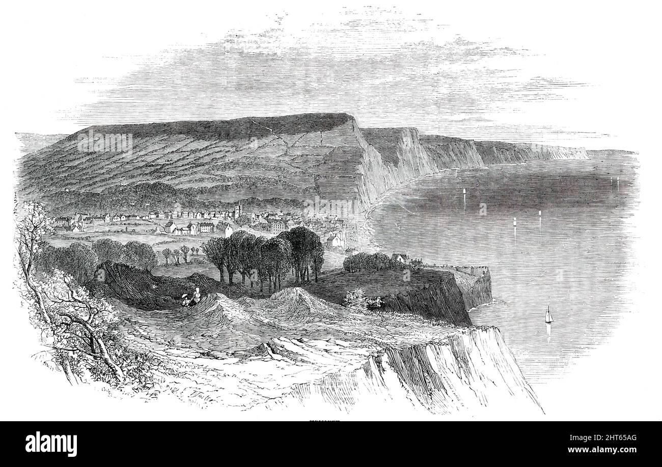 Les points d'eau du Devon - Sidmouth, 1850. 'Idmouth... se trouve dans un abri pittoresque. La plage est presque au centre de l'un de ces creux ou courbes qui sont abondants dans la vaste baie de Devon et Dorset s'étendant de l'île de Portland... le mur de mer, achevé en 1838, non seulement défend la ville de tout autre empiétement de la mer, mais forme une promenade sèche et très agréable de plus de 1700 pieds de longueur. Il faut à peine ajouter que la ville a l'hébergement d'un lieu d'arrosage bien aménagé". De "Illustrated London News", 1850. Banque D'Images