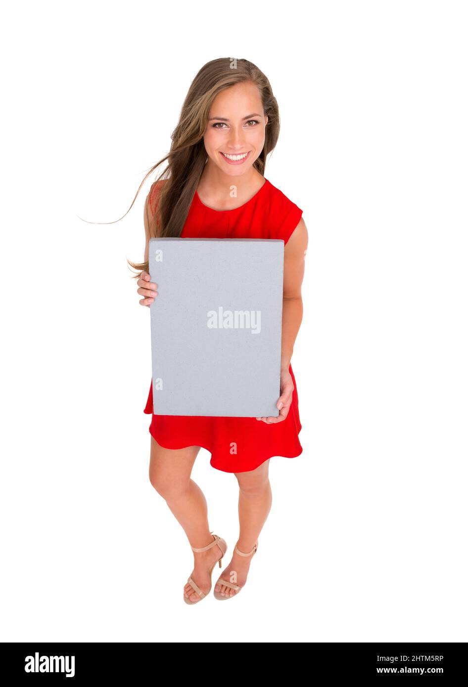 N'avisez pas votre produit. Photo en grand angle d'une jeune femme attrayante posant sur un fond blanc. Banque D'Images