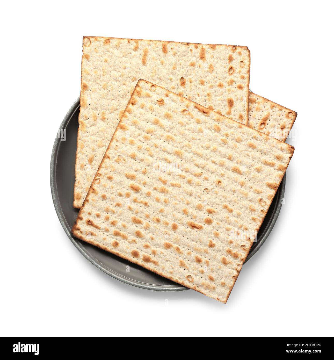 Assiette avec pain plat juif matza pour la Pâque sur fond blanc Banque D'Images