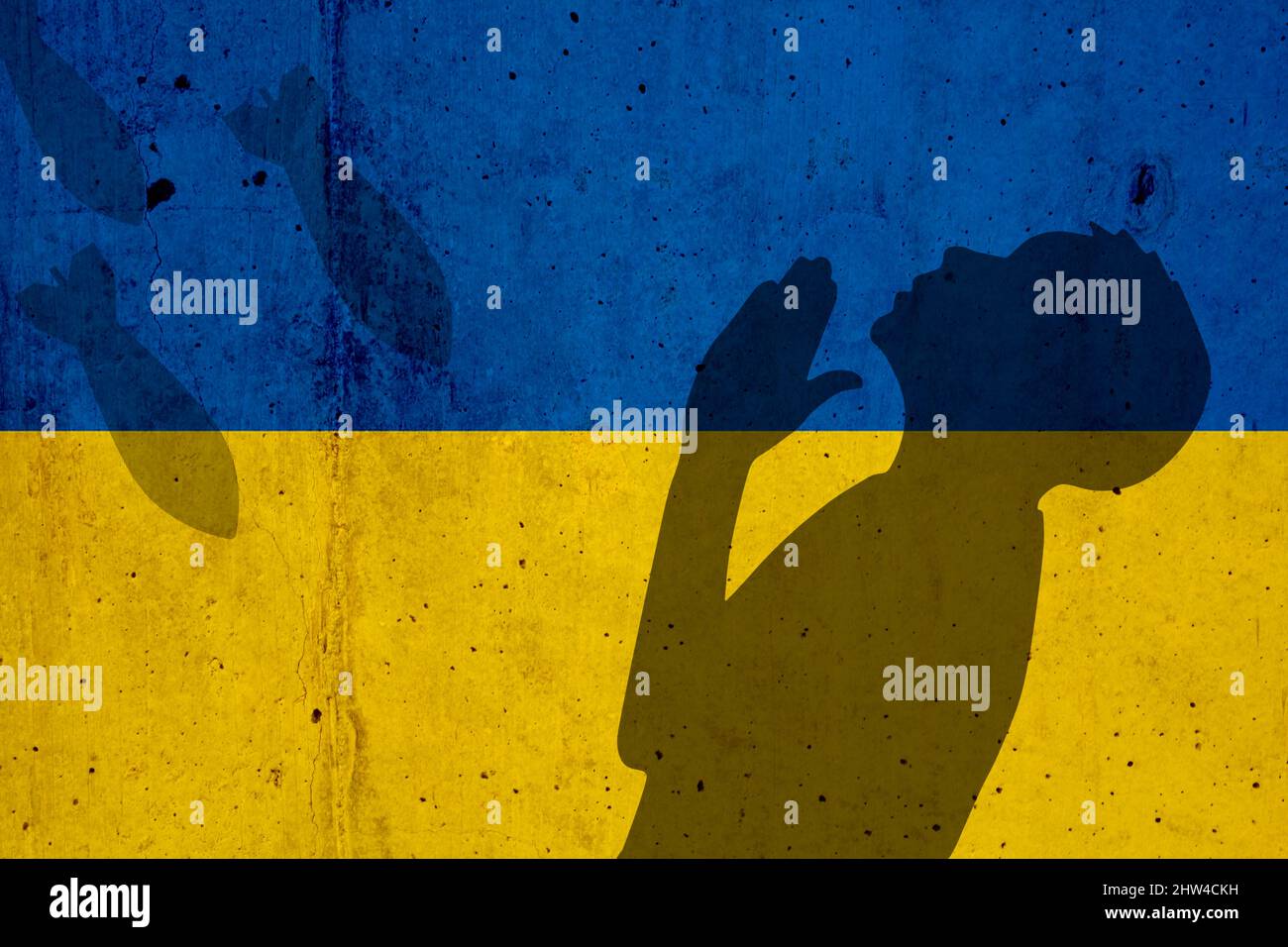 Ukraine drapeau et ombre de bombes et de prier enfant Banque D'Images