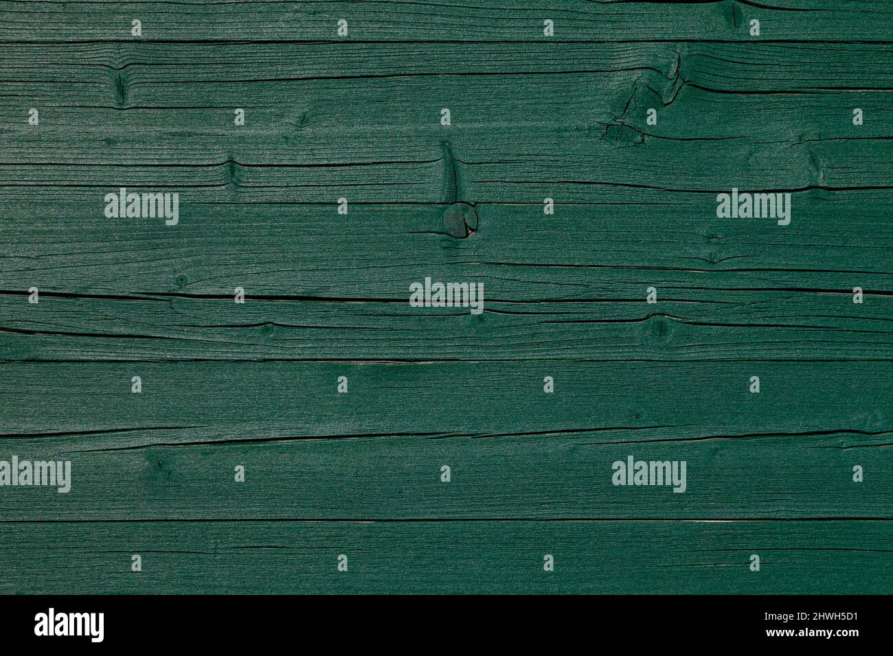 Clôture murale en bois vert foncé Résumé texture de fond rugueuse et abîmé Banque D'Images