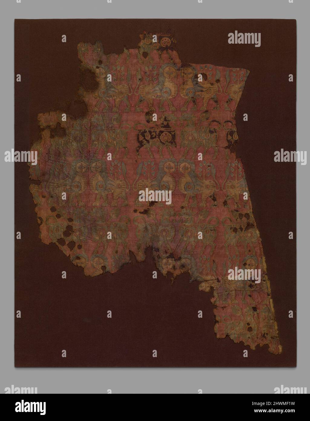 Fragment textile avec Bulls et Lions Banque D'Images