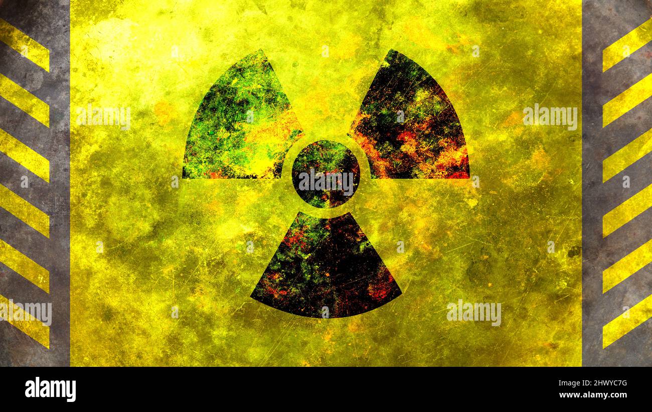 Panneau radioactif à l'énergie nucléaire, symbole jaune rond peint sur le mur, fond de texture. Avertissement d'alerte de rayonnement danger. Banque D'Images