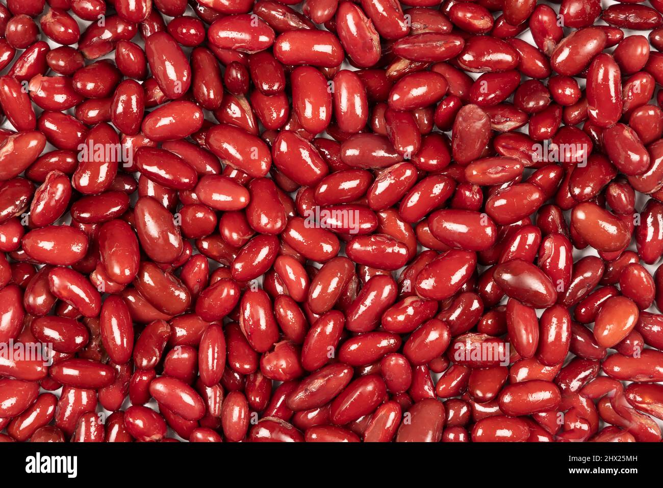 Gros plan de haricots rouges cuits. Arrière-plan plein format. Banque D'Images