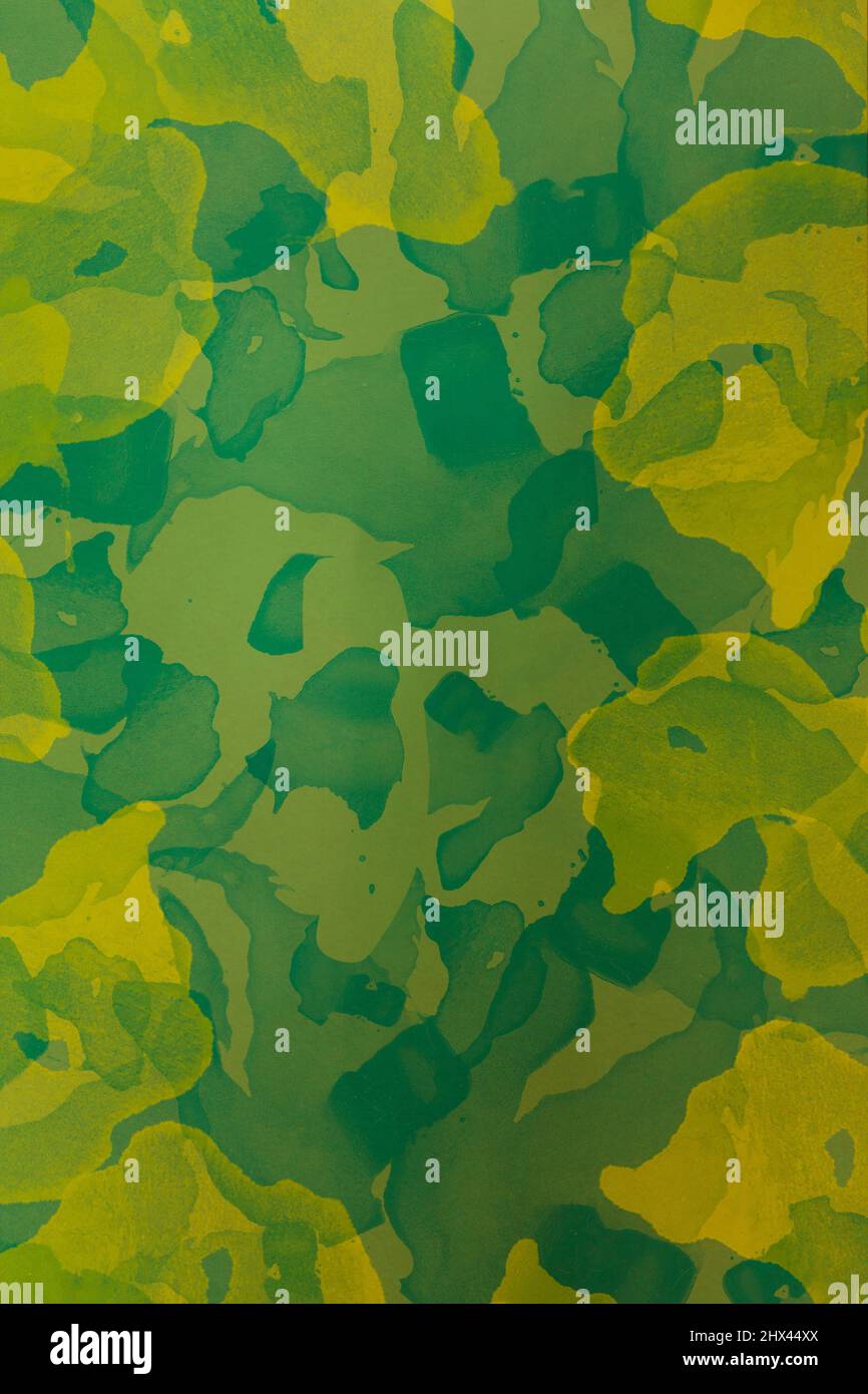 Arrière-plan artistique de studio peint avec des formes abstraites dans des tons de vert camouflage. Banque D'Images