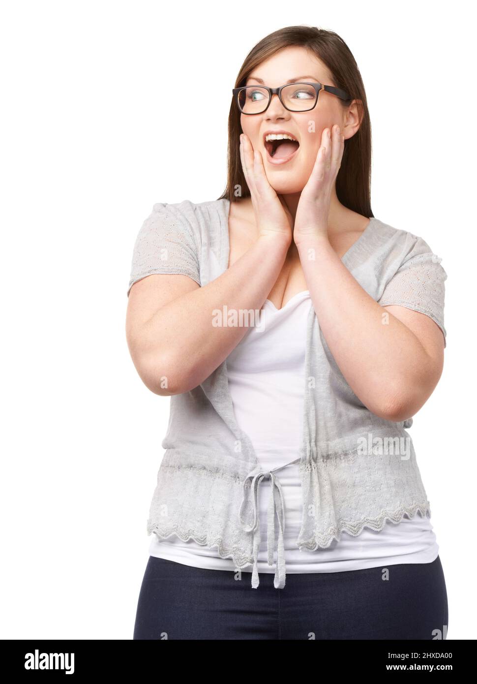 Oh, quelle affaire. Une femme pleine de figuré regardant quelque chose avec le choc alors qu'isolée sur blanc. Banque D'Images