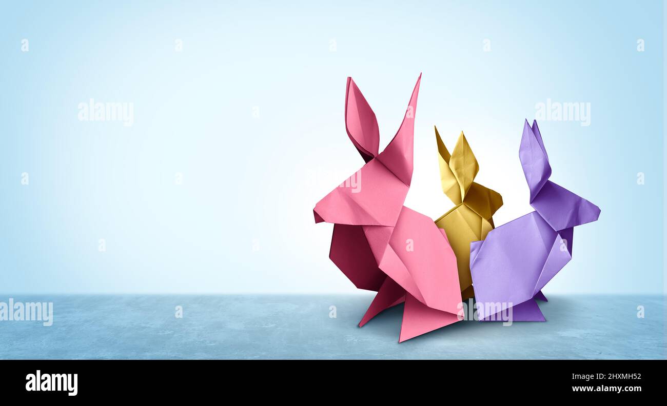 Les lapins de Pâques sont des lapins en papier de groupe de printemps ou des créations artistiques et artisanales festives d'avril avec un origami de lapin. Banque D'Images