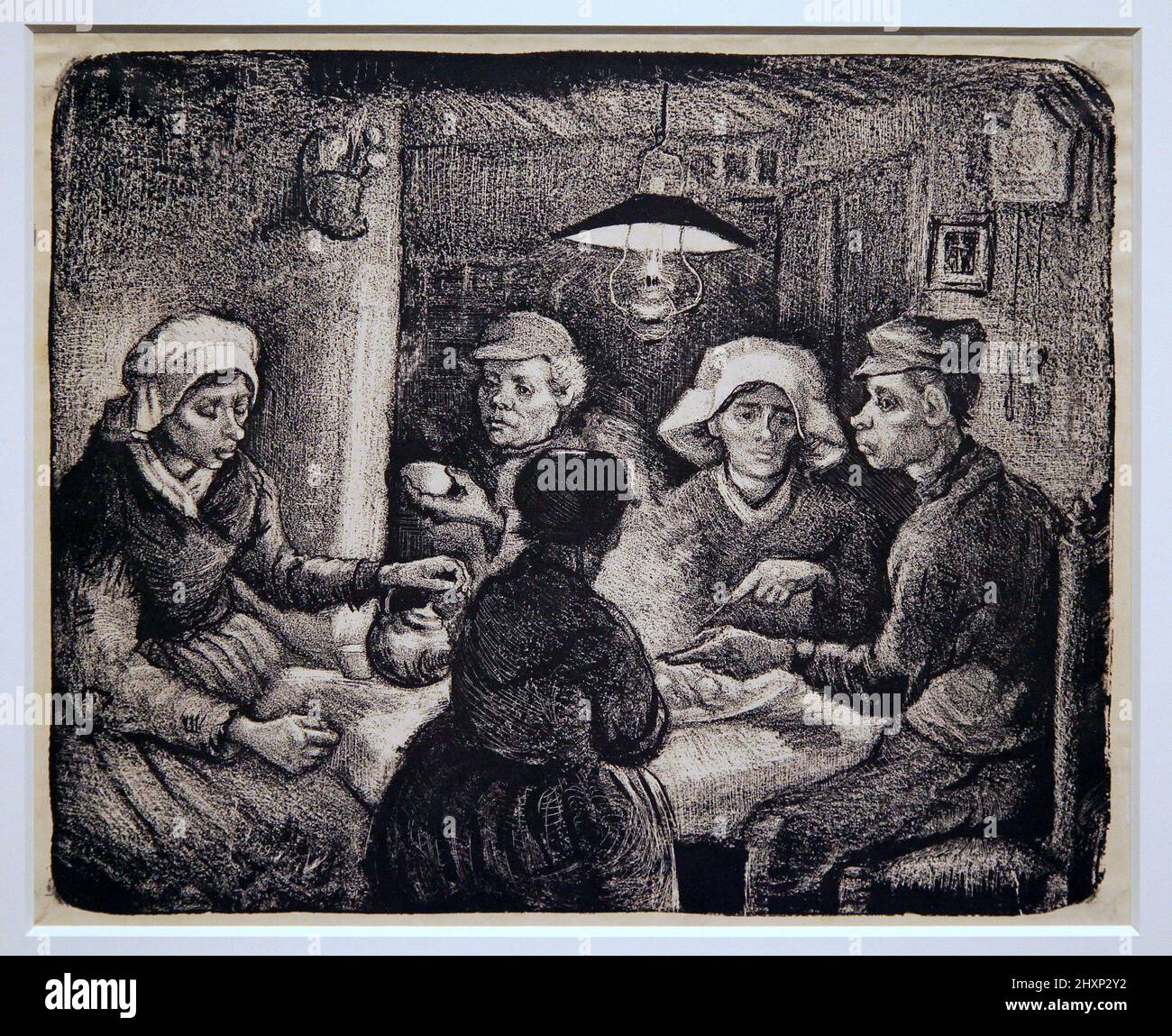 Les mangeurs de pommes de terre.de Aardappeleters (1885) de Vincent van Gogh.(1853-1890).Une lithographie en noir. Banque D'Images