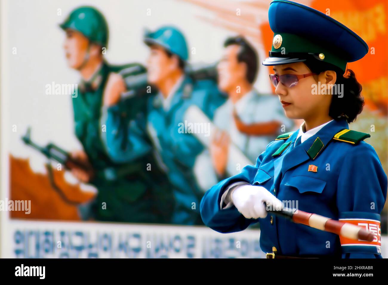 Pyongyang traffic lady et affiche de propagande, Corée du Nord Banque D'Images