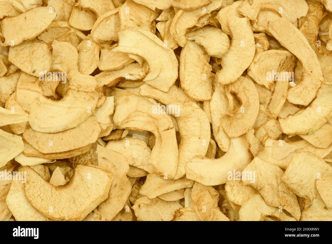 Fond de tranches de pomme séchées. Croustilles aux pommes. Texture saine des aliments. Banque D'Images