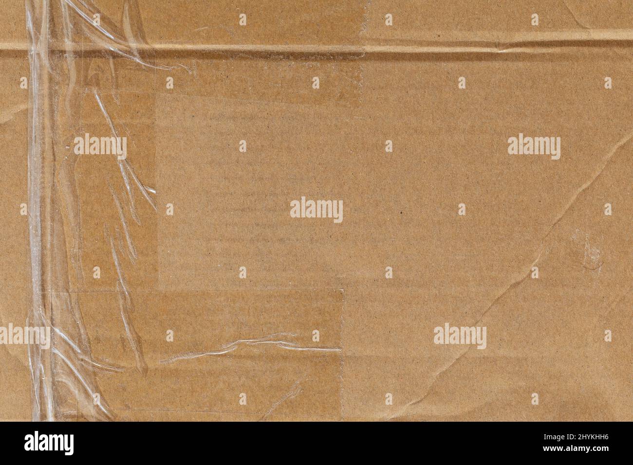 Texture de carton usée avec ruban transparent Banque D'Images