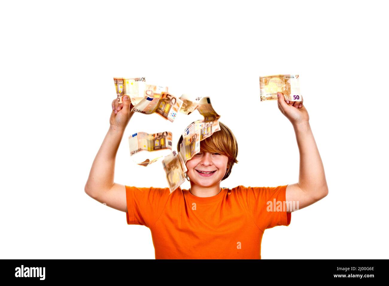 Euros volant autour d'une tête garçons Banque D'Images