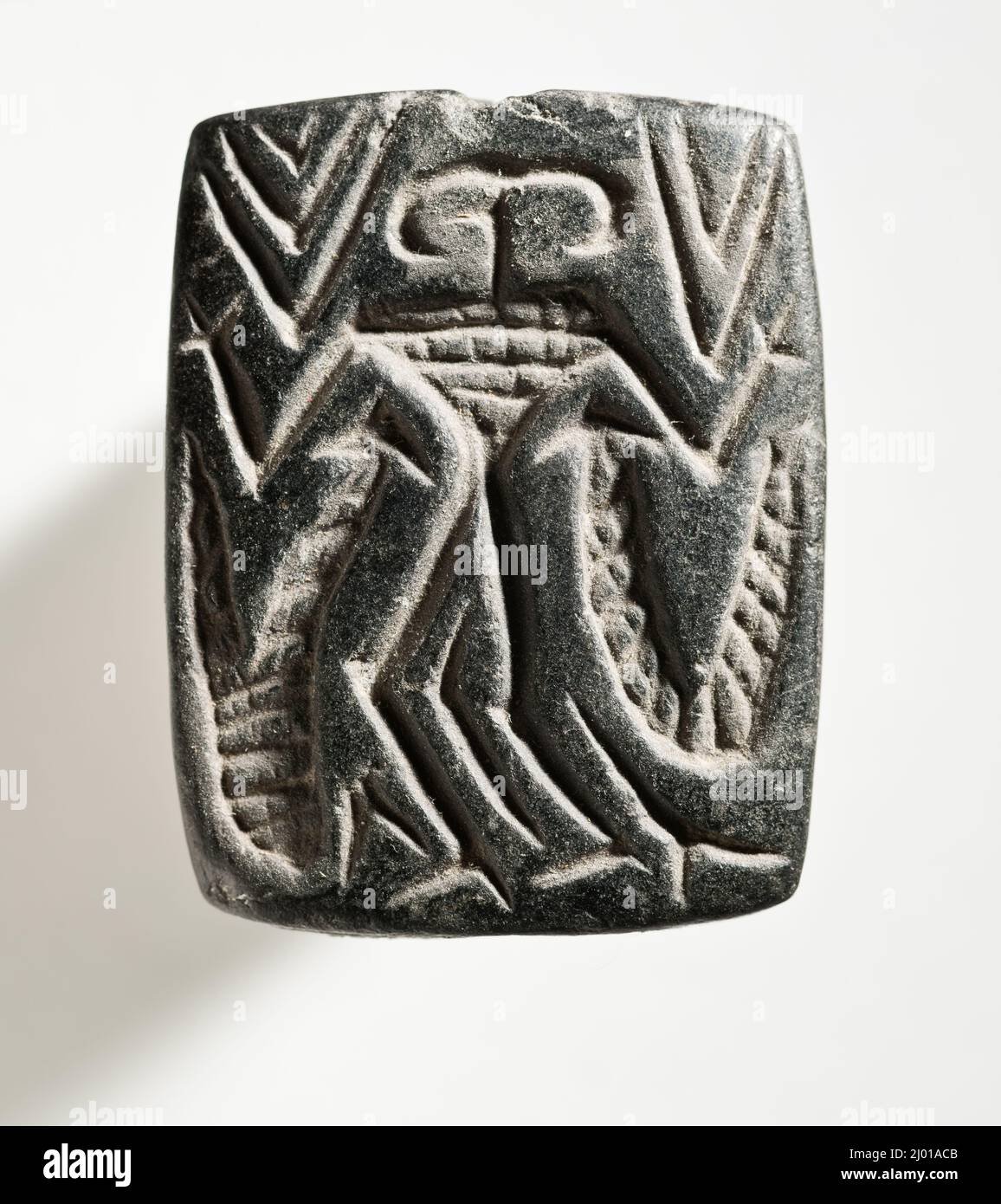 Cachet, plaque. Ouest de l'Iran, vers 4th millénaire avant J.-C.. Outils et équipement; joints. Serpentin noir Banque D'Images