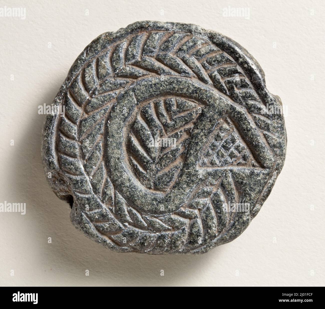 Cachet. Mésopotamie du Nord, vers le 4th millénaire C.-B.. Outils et équipement; joints. Serpentin noir Banque D'Images