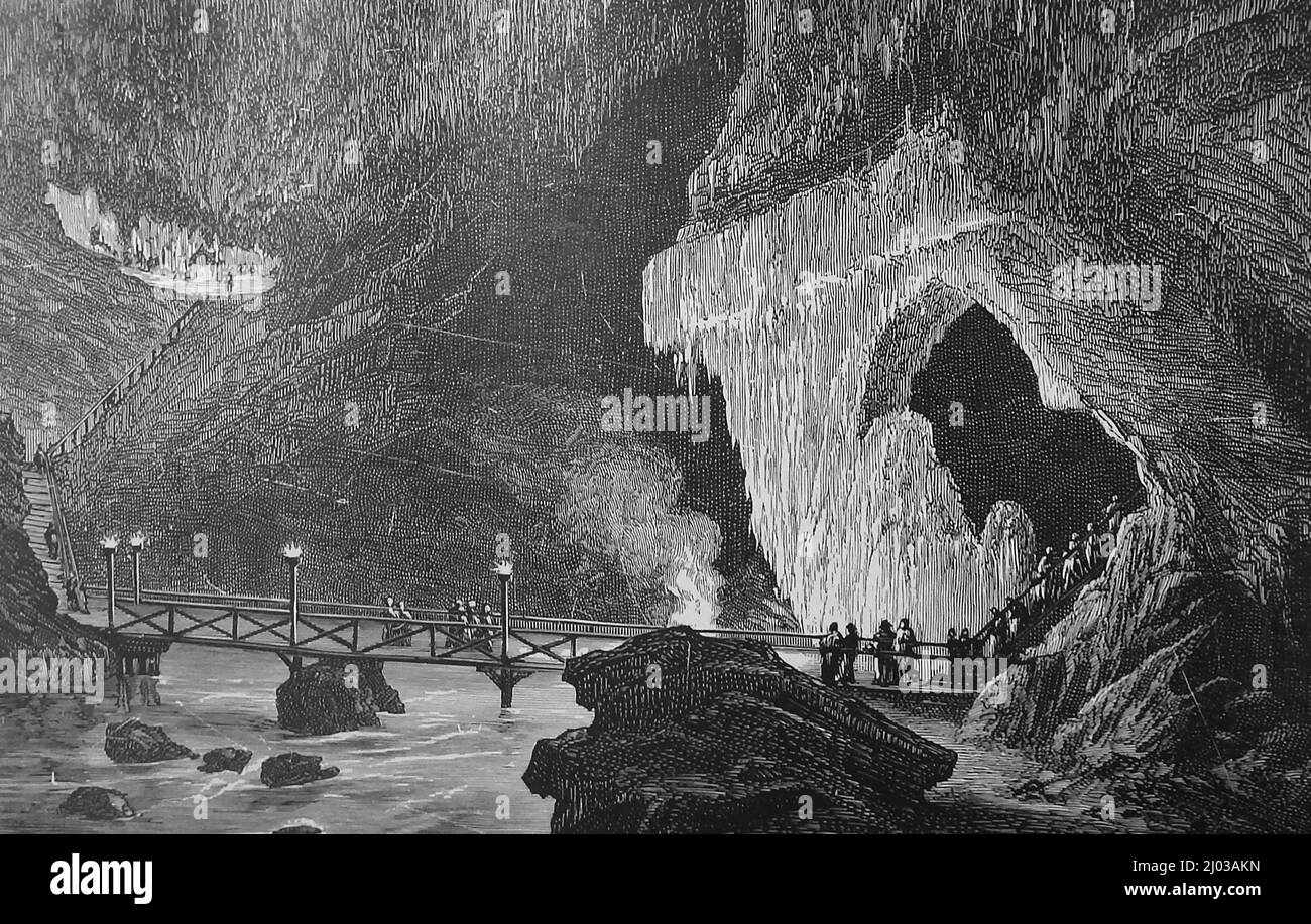 Une illustration de la grotte d'Adelsberg à la fin des années 1800. Maintenant plus souvent Une illustration de la grotte à Adelsberg à la fin des années 1800 est maintenant plus souvent appelée les grottes de Postojna, Postojnska jama, Grotte di Postumia ou Grotte d'Adelsberger. Le vaste système de grottes de Postojna (le sistem de Postojnski jamski), est situé près de Postojna aka Adelsberg ou Postumia en Slovénie et est classé deuxième plus grand système de grottes de stalactites au monde (après la grotte de Jeita au Liban) d'environ 15 miles de long. Banque D'Images