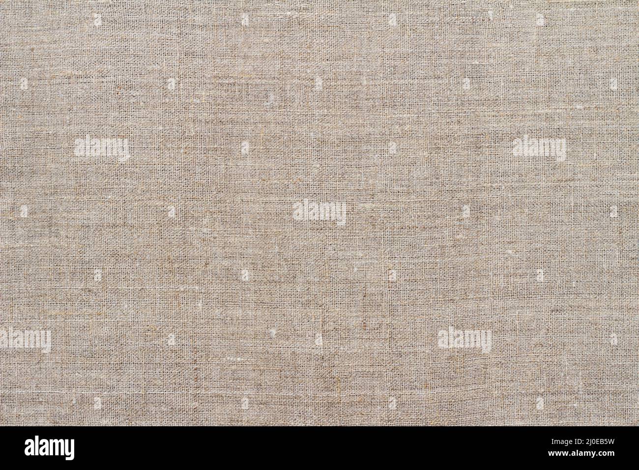 Tissu, arrière-plan ou texture en lin naturel, couleur beige gris naturel, vue du dessus, gros plan, horizontal Banque D'Images