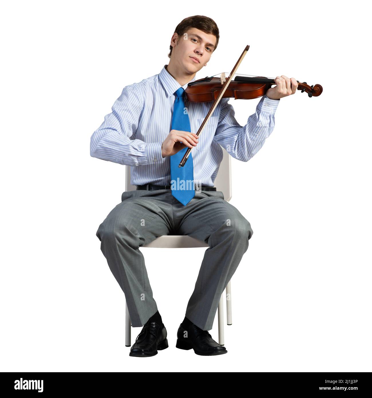 homme d'affaires sur une chaise avec violon Banque D'Images