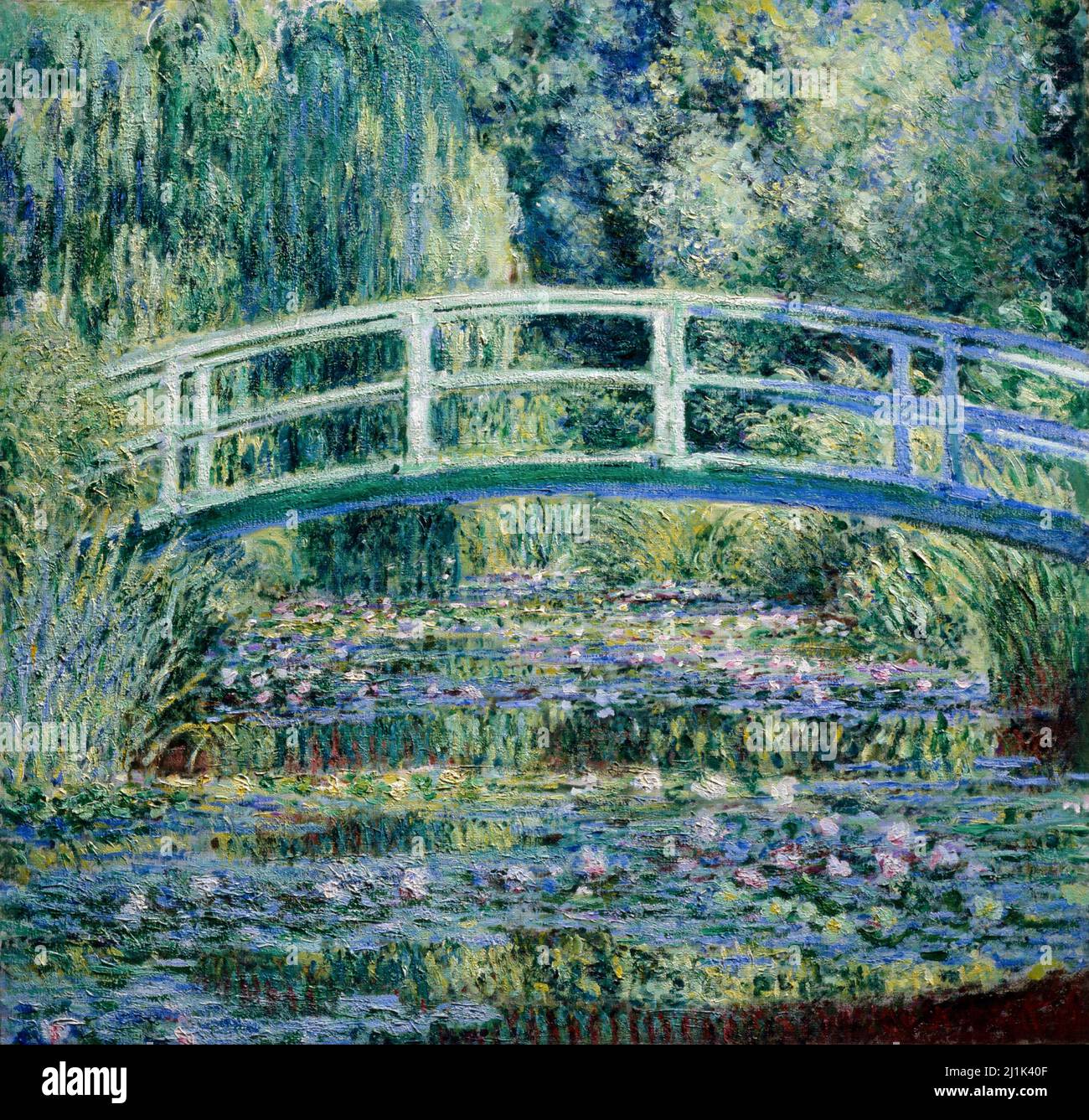 Les lilas d'eau de Claude Monet et le pont japonais (1899) célèbre peinture Banque D'Images
