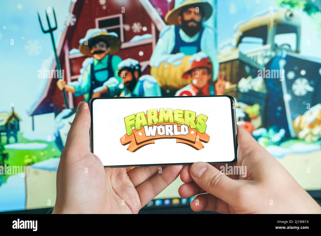 Russie Moscou 25.12.2021 logo de Farmers World. Blockchain nft ethereum  crypto-monnaie jeu de stratégie dans ordinateur portable, téléphone mobile.Man  jouant pour crypto coi Photo Stock - Alamy