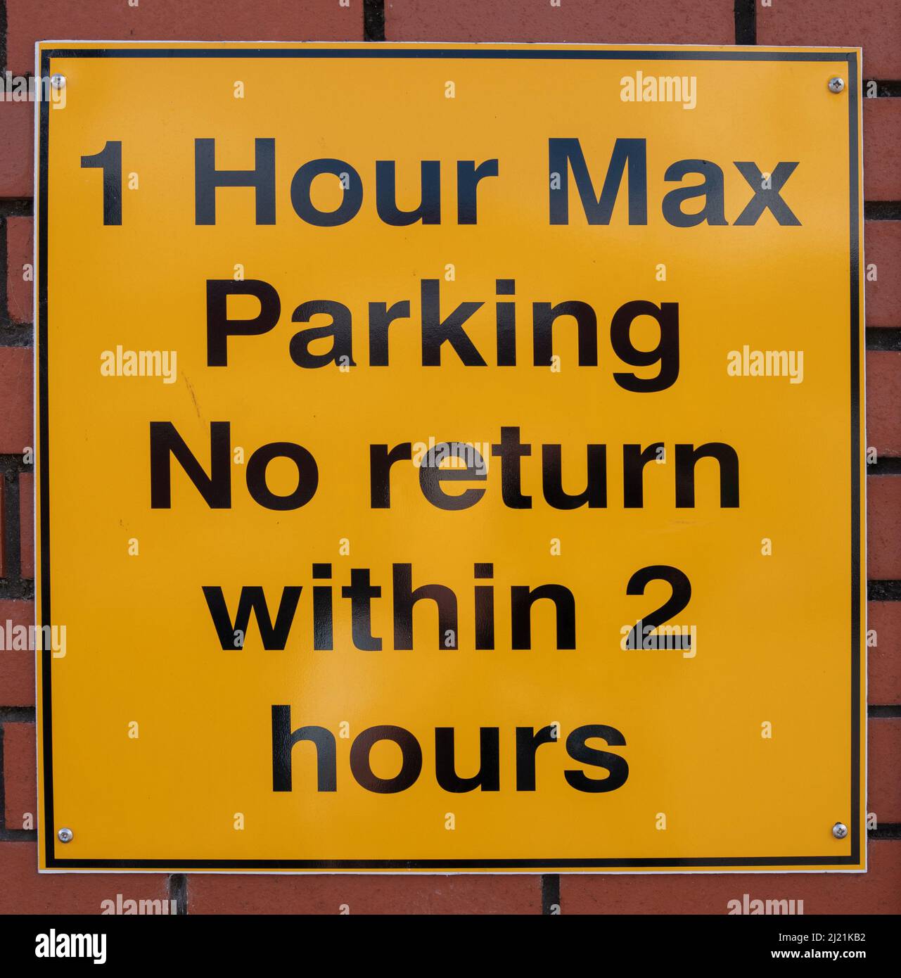 1 Hour Max parking Sign texte noir sur fond jaune Banque D'Images 1 Hour Max parking Sign texte noir sur fond jaune Banque D'Images