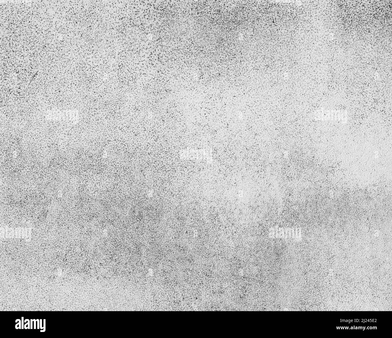 Grunge gris texture inégale de la surface en béton fond avec des taches noires Banque D'Images