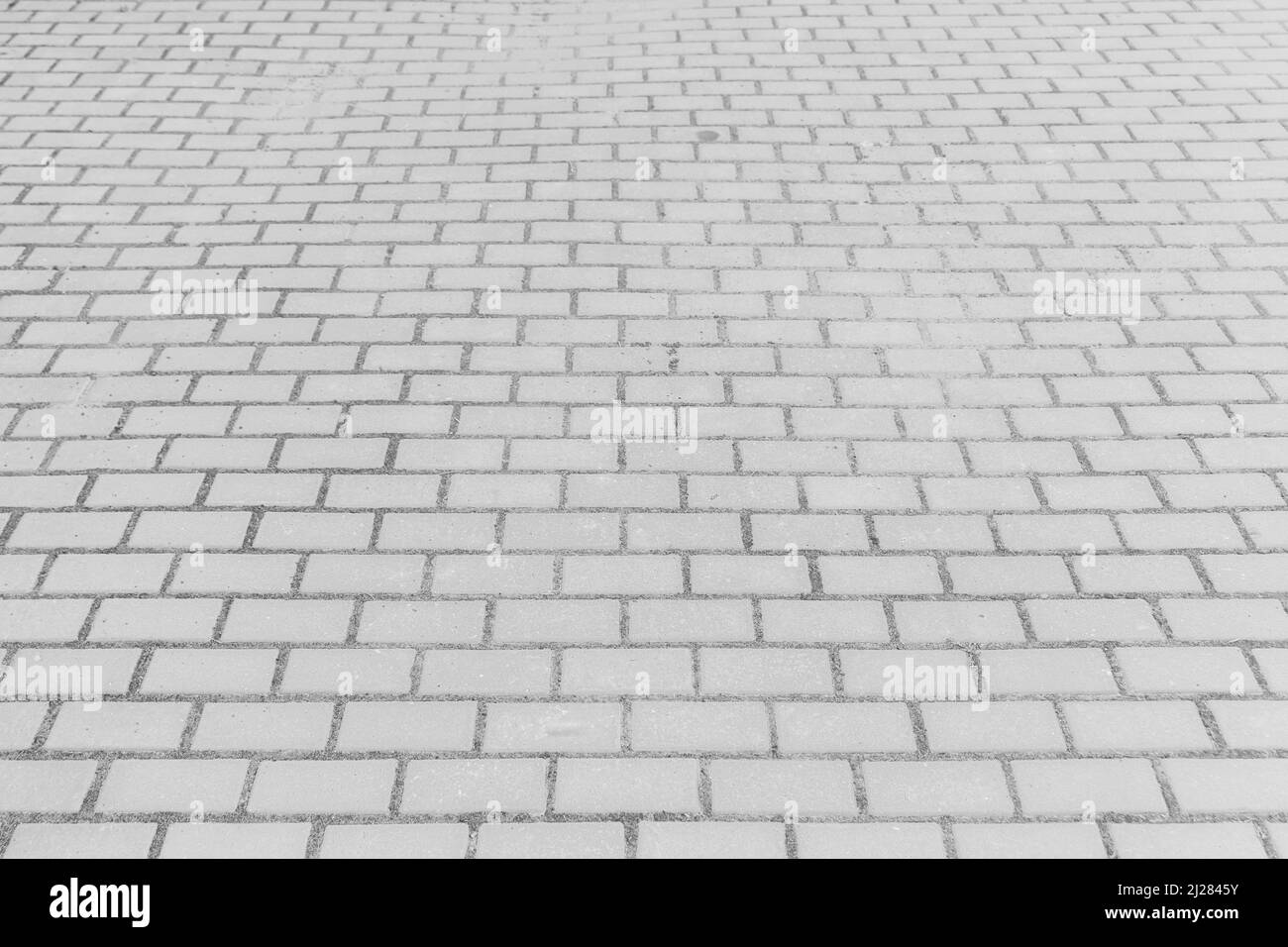 Carrelage gris rue pierre ville route abstrait modèle urbain design texture revêtement fond de plancher. Banque D'Images