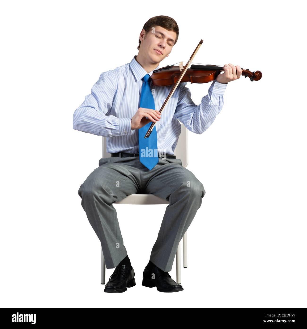homme d'affaires sur une chaise avec violon Banque D'Images