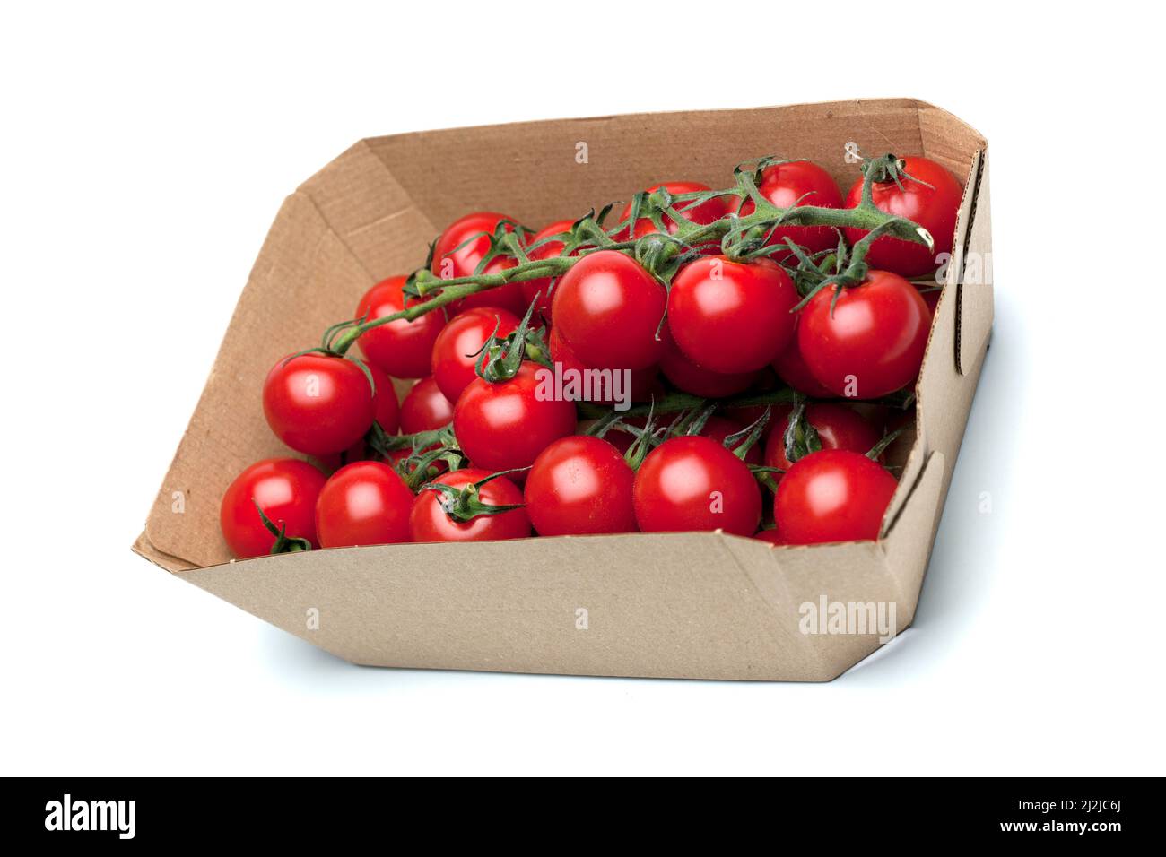 Punnet en carton de tomates cerises Banque D'Images