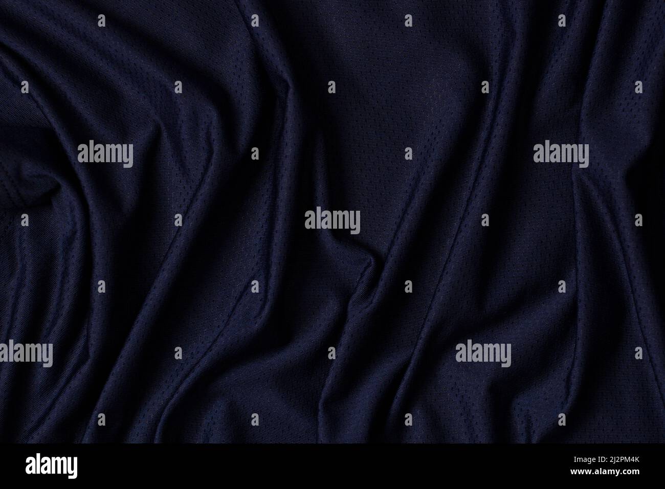 Vêtements de sport tissu texture arrière-plan. Tissu bleu marine vêtements de sport jersey de football avec fond de texture en maille d'air. Vue de dessus Banque D'Images