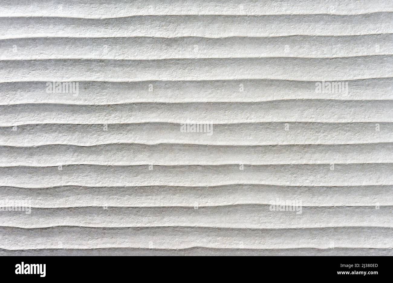Carreaux de céramique gris avec effet ondulé. Texture de carreaux de céramique rugueuse. Banque D'Images