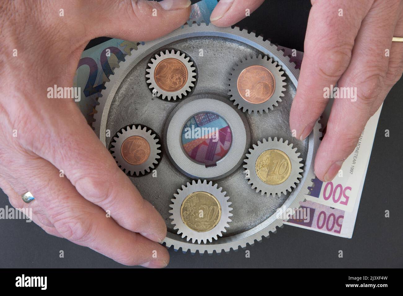 Euro, Zahnräder,Hände Banque D'Images