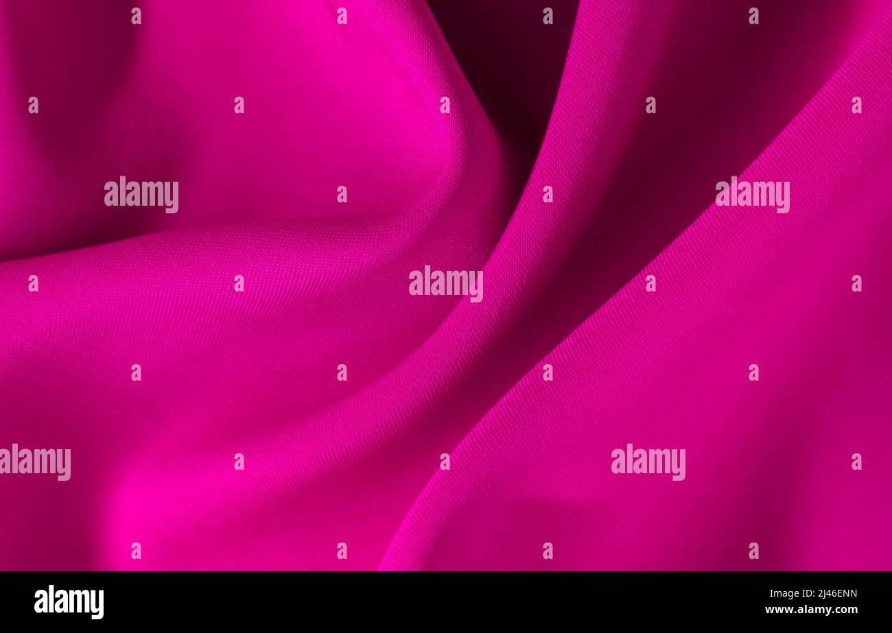 Arrière-plan en tissu rouge avec oxen. Tissu bordeaux froissé. Textile. Matériel de vêtement Banque D'Images