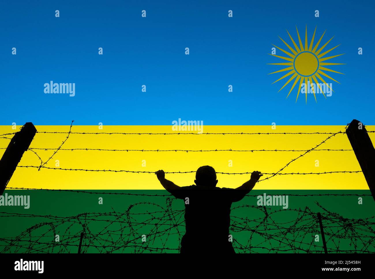 Homme derrière le barbelé et le drapeau du Rwanda. UK offshore traitement de l'asile, la réinstallation, les réfugiés, l'immigration... concept Banque D'Images