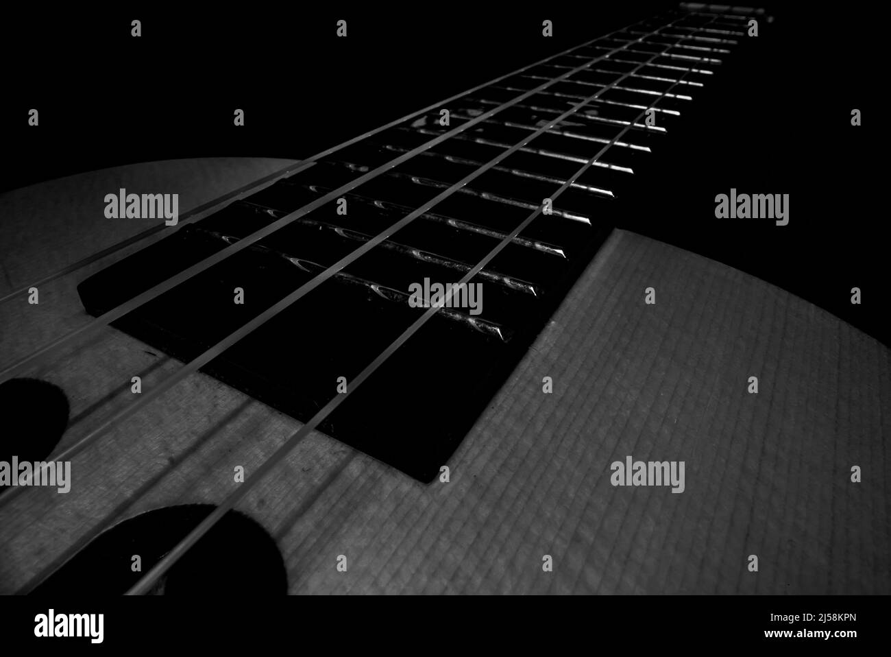 Tableau de fretboard d'un ukulele hawaïen à quatre cordes. Banque D'Images