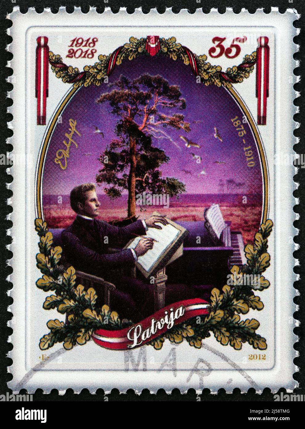LETTONIE - VERS 2012 : un timbre imprimé en Lettonie à l'occasion de l'anniversaire de la République de Lettonie en 100th montre le compositeur Emils Darzins, vers 2012. Banque D'Images