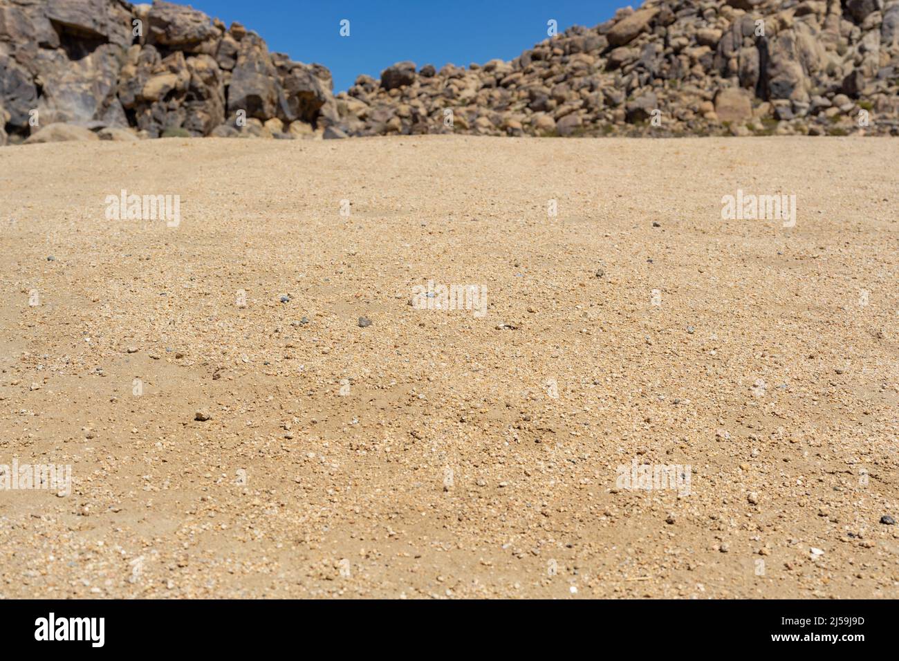 Vue rapprochée sur le sable et les rochers dans le désert de Mojave Banque D'Images