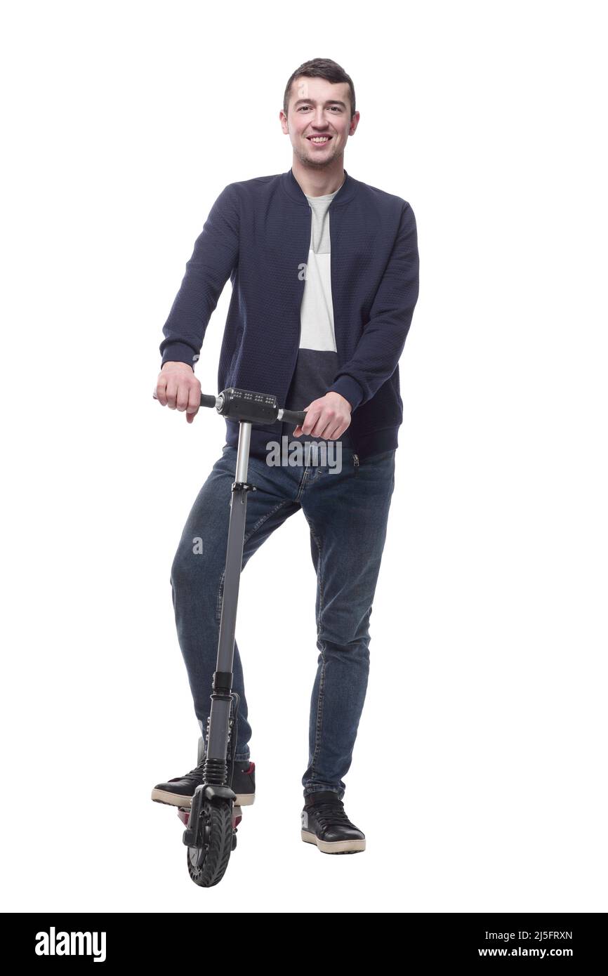 jeune homme souriant avec un scooter électrique . Banque D'Images